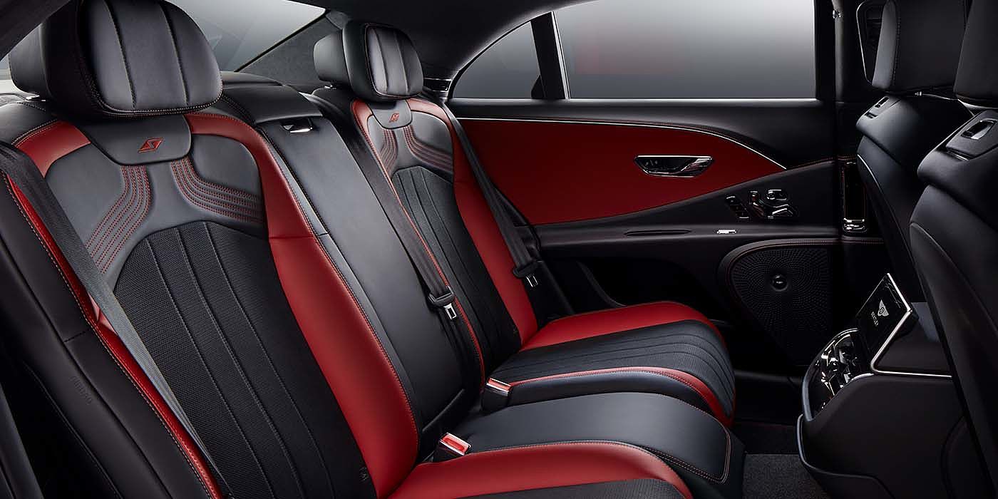 Bentley Leusden Bentley Flying Spur S sedan rear interior in Beluga black and Hotspur red hide with S stitching