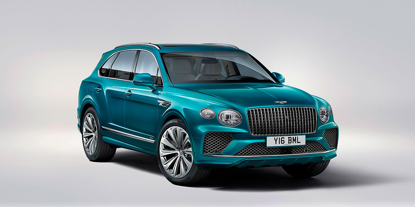 Bentley Leusden Bentley Bentayga Azure front three-quarter view, featuring a fluted chrome grille with a matrix lower grille and chrome accents in Topaz blue paint.