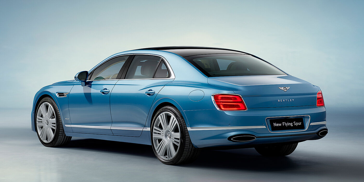 Bentley Leusden New Bentley Flying Spur Azure sedan rear view in Light windsor blue by Mulliner paint with 22 inch Azure wheels and chrome exterior details
