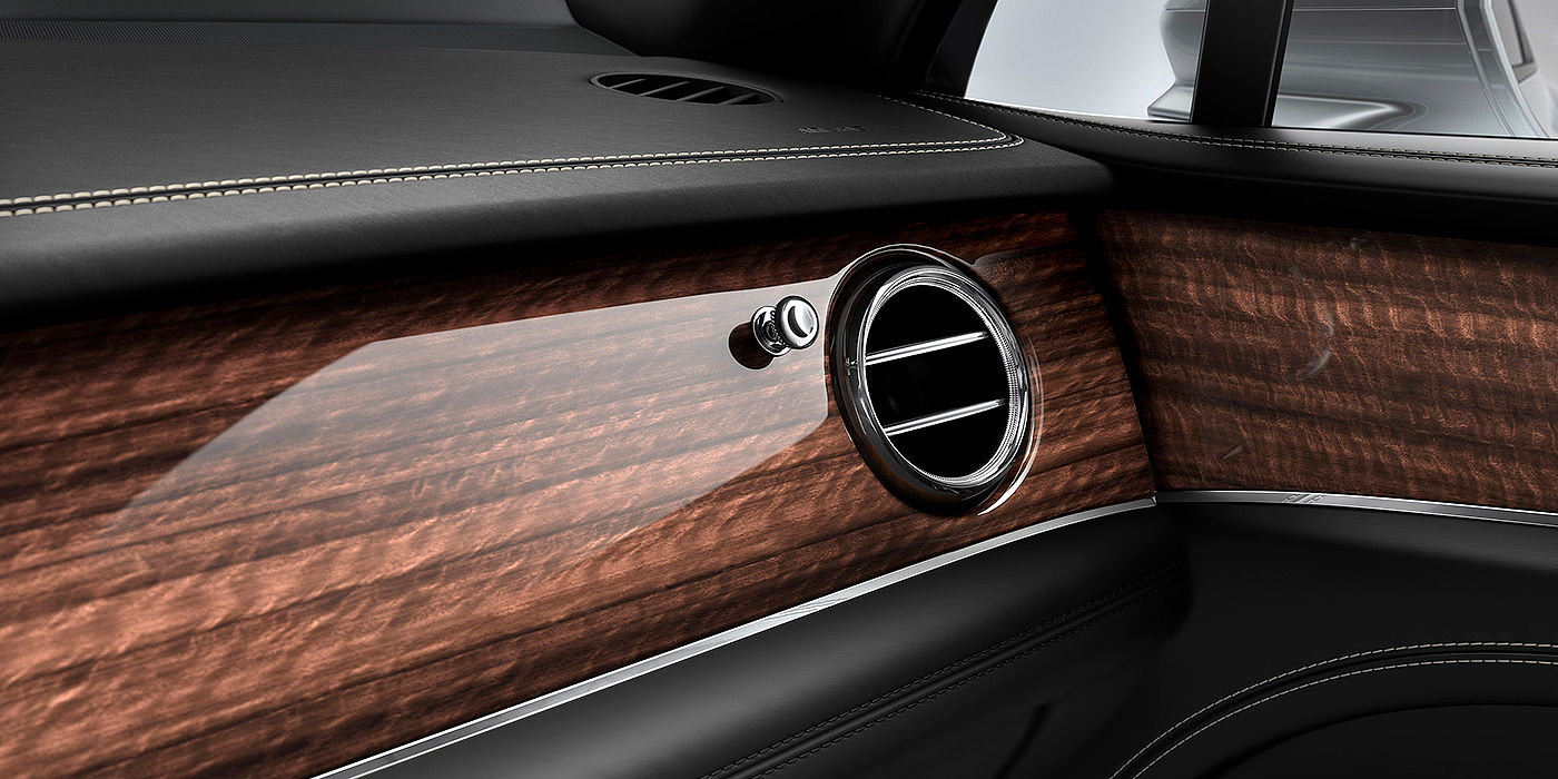 Bentley Leusden Bentley Bentayga front interior Crown Cut Walnut veneer and chrome air vent.