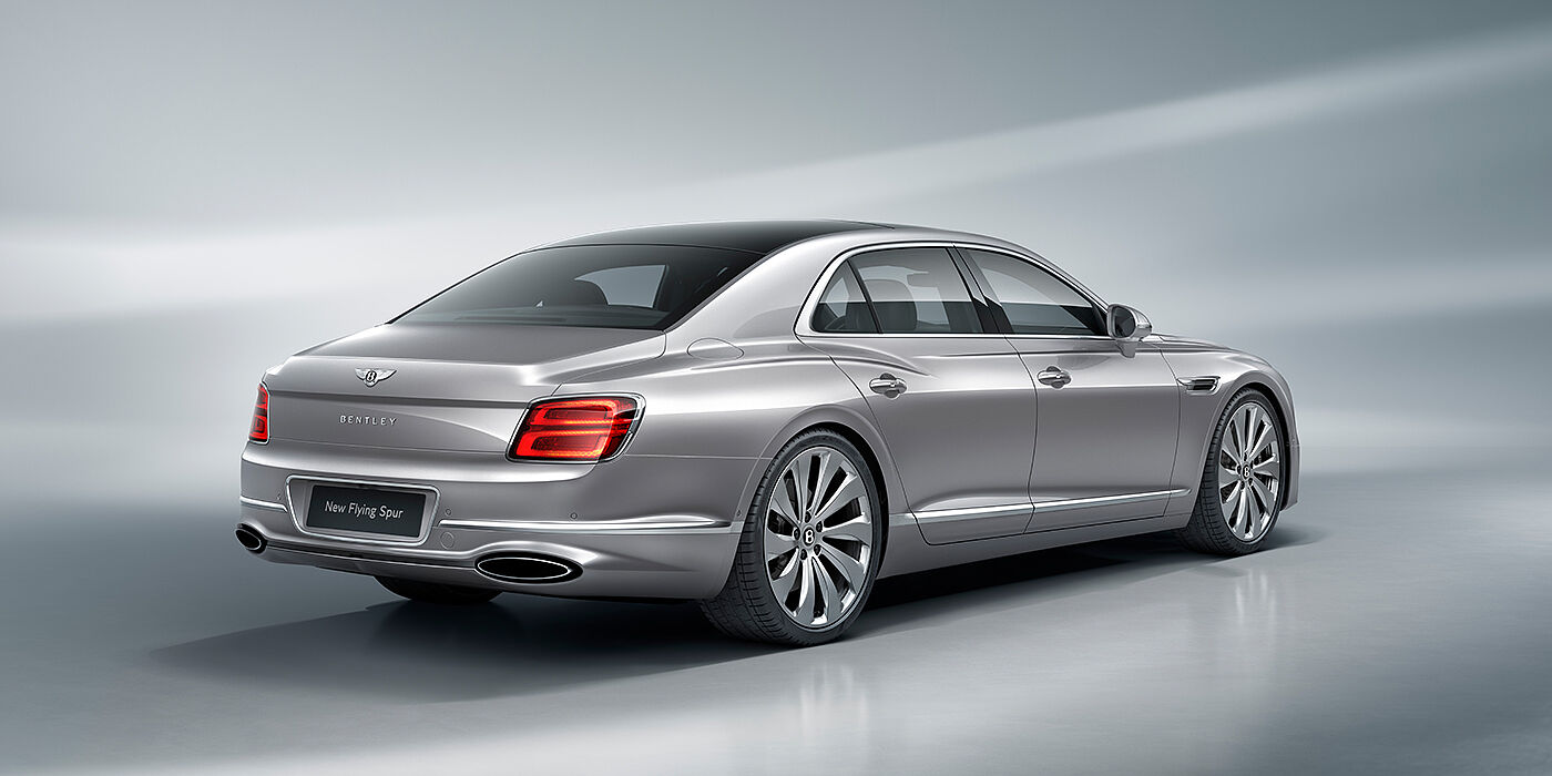 Bentley Leusden New Bentley Flying Spur sedan rear view in Silverlake paint with ten spoke wheels and chrome matrix grille