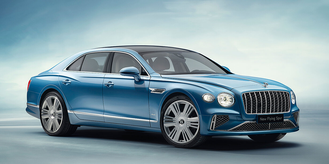 Bentley Leusden New Bentley Flying Spur Azure sedan front view in Light windsor blue by Mulliner paint with 22 inch Azure wheels and chrome exterior details