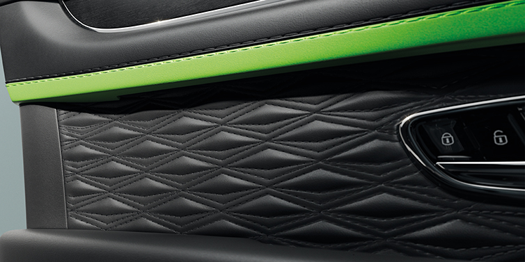 Bentley Leusden Bentley Bentayga Speed SUV interior door detail with Diamond in Diamond stitched hide in Beluga black colour, with Black stained Crown Cut Walnut veneer