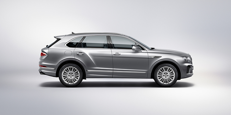 Bentley Leusden Bentley Bentayga SUV side profile in Moonbeam silver paint against white background featuring 21 inch 5 spoke wheels